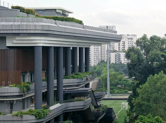 Grecian columns and just a hint of a football pitch, as seen from the roof of One Punggol